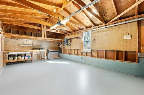 a view of a cars park in front of a building