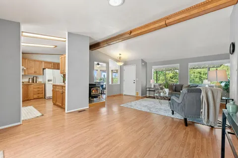 a view of a livingroom with furniture and hardwood floor