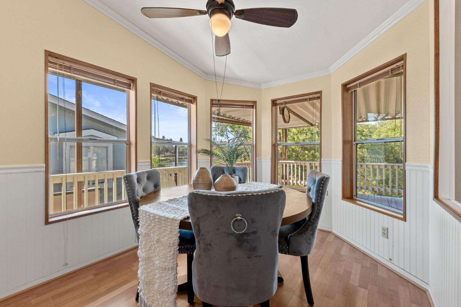 4390 Patterson Drive, Unit 218 Diamond Springs, CA 95619 - Photo 9 of 45 a dining room with furniture a chandelier and wooden floor