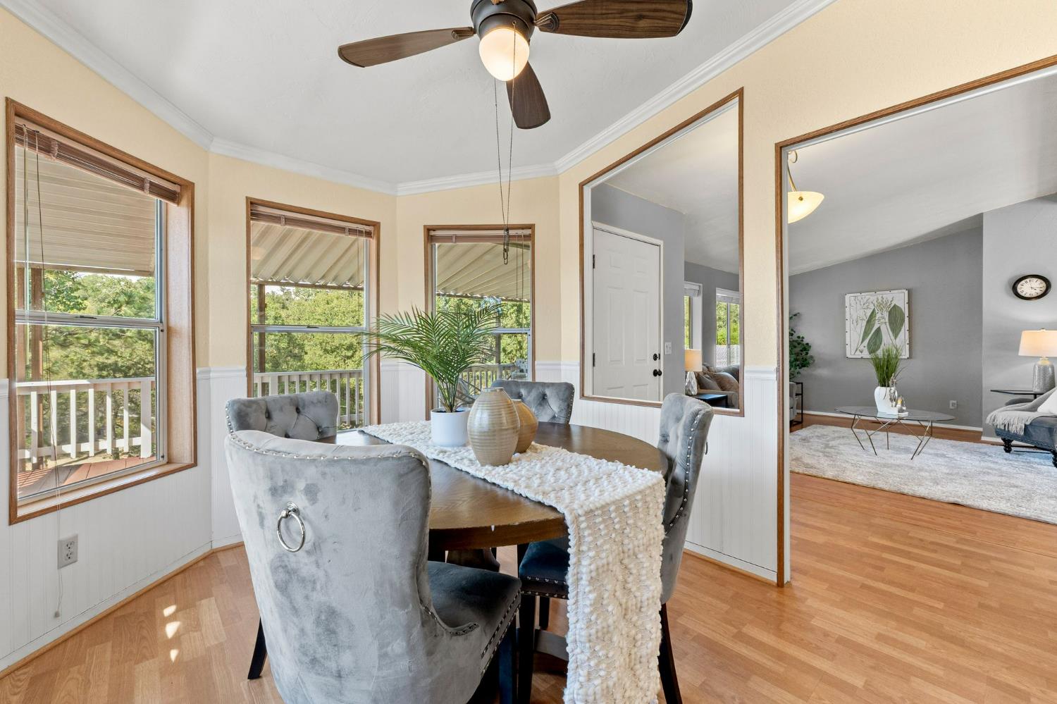 4390 Patterson Drive, Unit 218 Diamond Springs, CA 95619 - Photo 10 of 45 a view of a dining room with furniture window and wooden floor