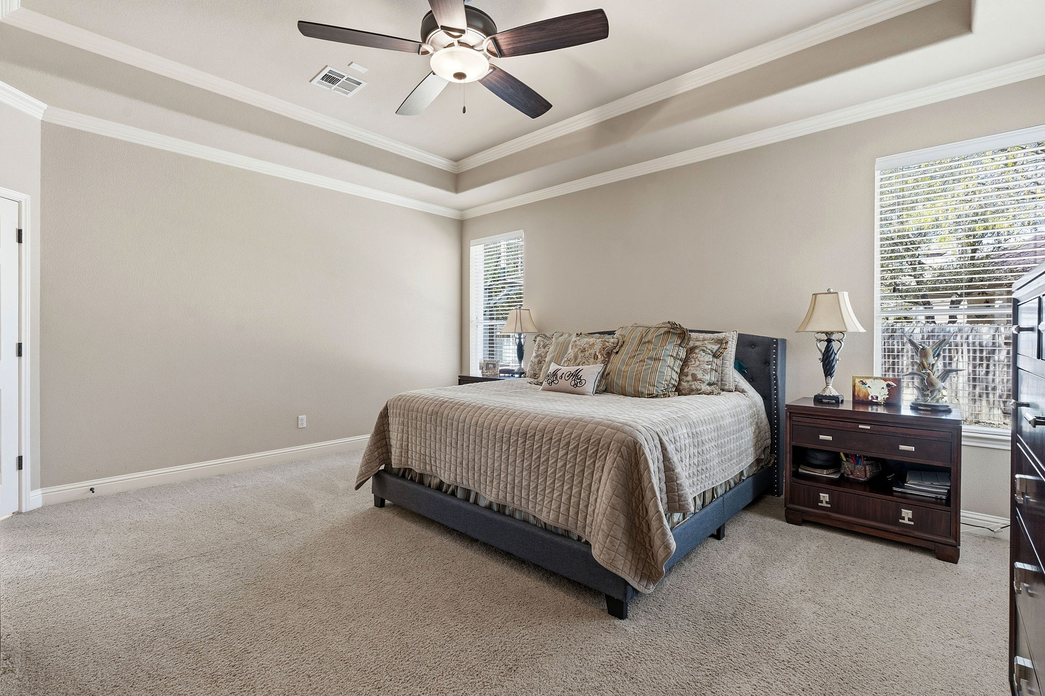 2807 Rambler Valley Drive Cedar Park, TX 78613 - Photo 19 of 38 a bedroom with a bed and a chandelier