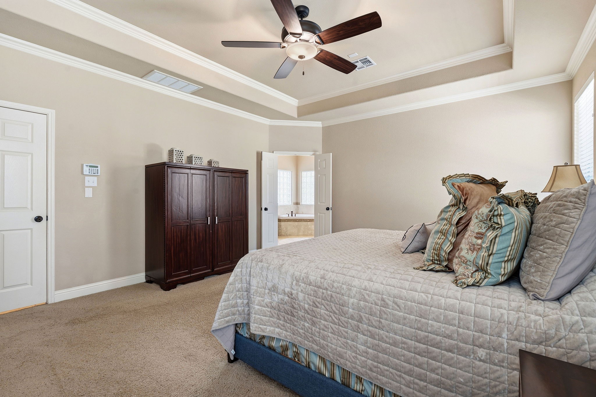 2807 Rambler Valley Drive Cedar Park, TX 78613 - Photo 21 of 38 a bedroom with a bed and ceiling fan
