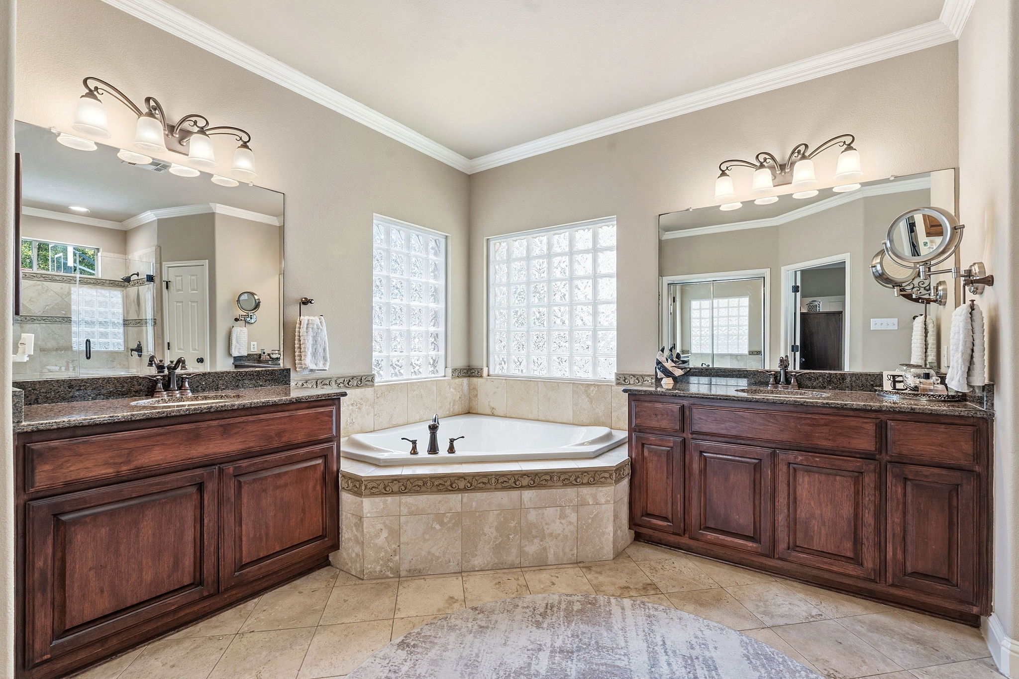 2807 Rambler Valley Drive Cedar Park, TX 78613 - Photo 22 of 38 a spacious bathroom with a tub a double vanity sink and a mirror