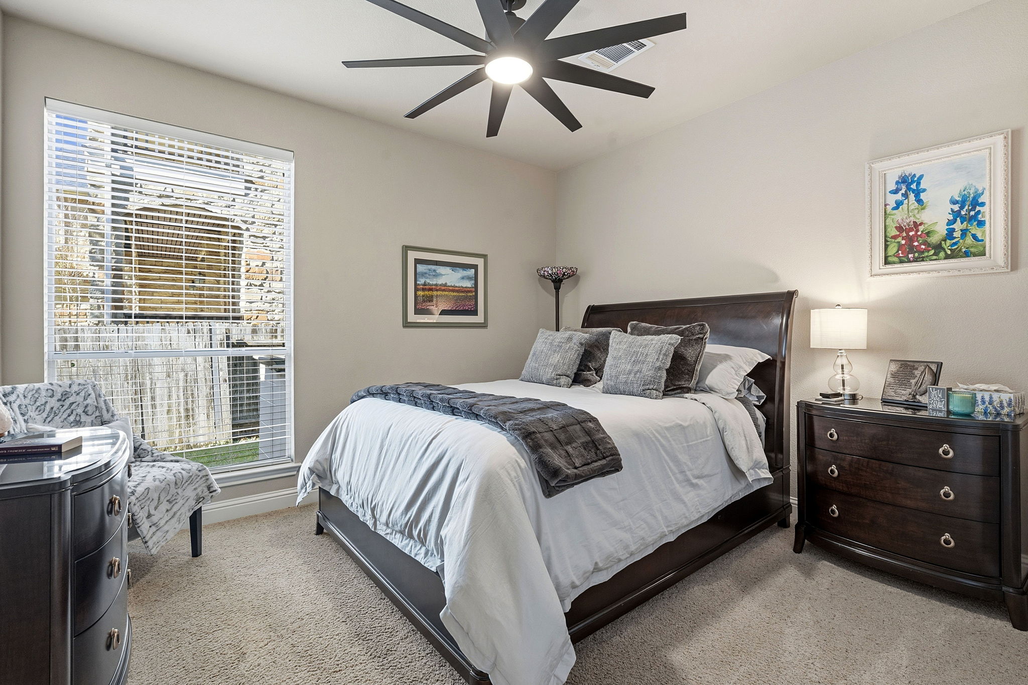 2807 Rambler Valley Drive Cedar Park, TX 78613 - Photo 24 of 38 a bedroom with a bed and a chandelier