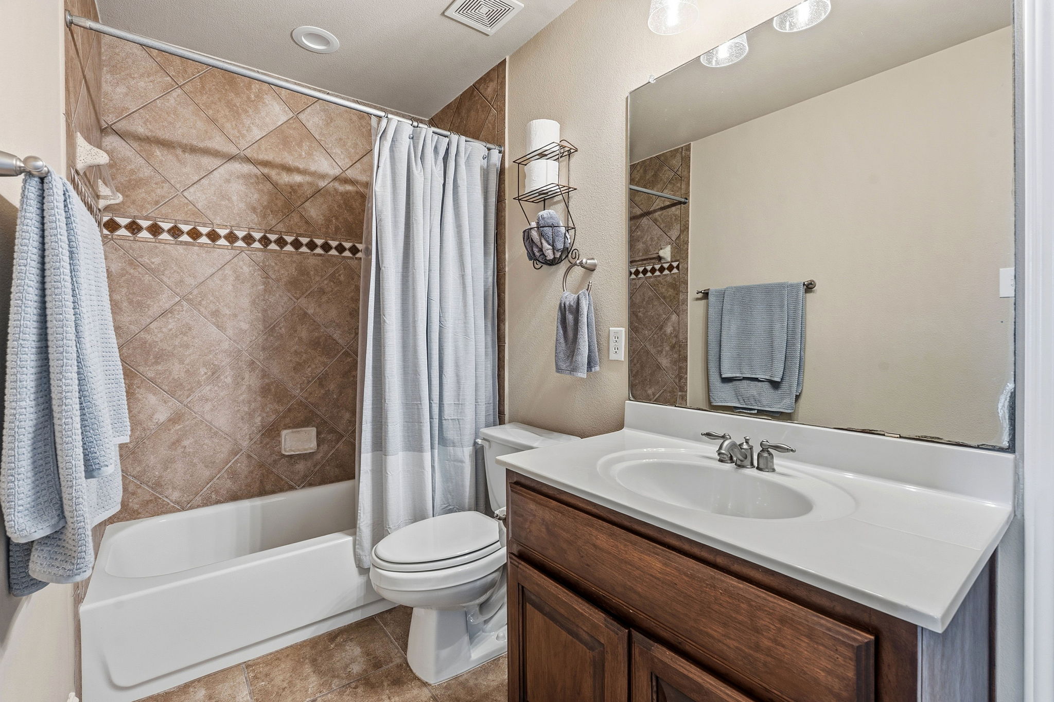 2807 Rambler Valley Drive Cedar Park, TX 78613 - Photo 27 of 38 a bathroom with a sink toilet and shower
