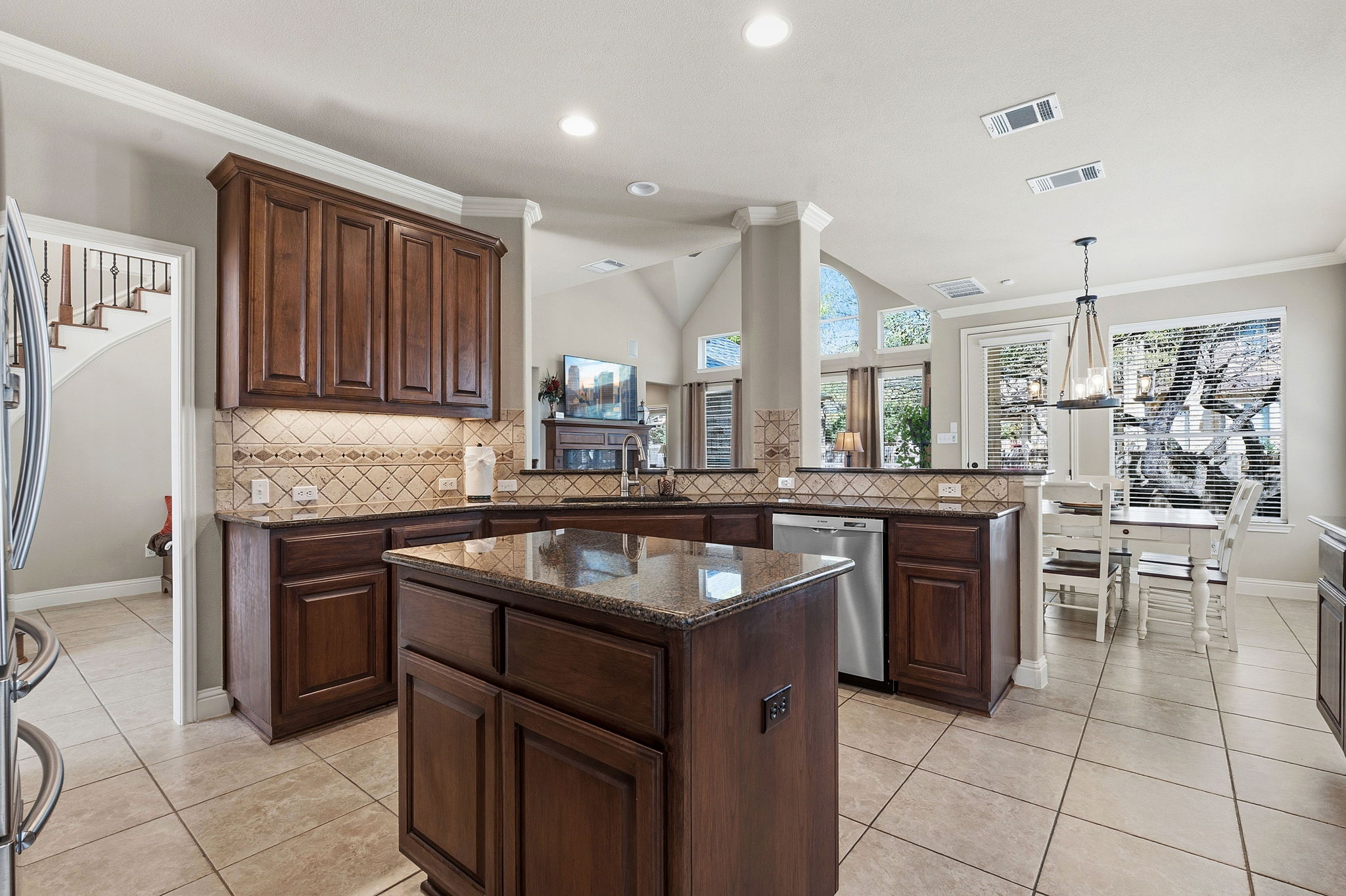 2807 Rambler Valley Drive Cedar Park, TX 78613 - Photo 7 of 38 a kitchen with kitchen island granite countertop a sink stove and cabinets