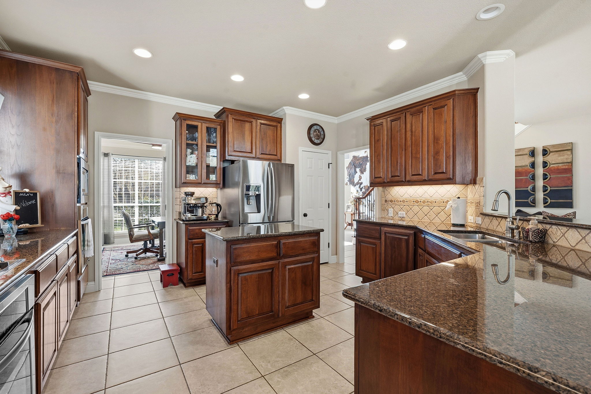 2807 Rambler Valley Drive Cedar Park, TX 78613 - Photo 8 of 38 a kitchen with stainless steel appliances granite countertop a stove top oven a sink dishwasher and cabinets with wooden floor