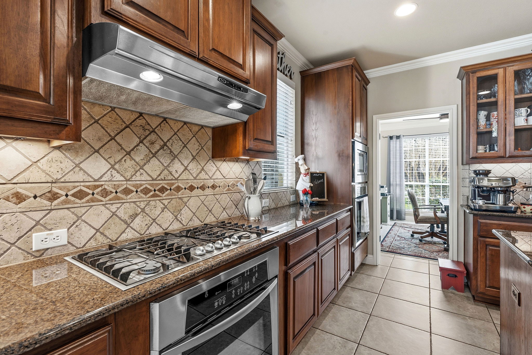 2807 Rambler Valley Drive Cedar Park, TX 78613 - Photo 9 of 38 a kitchen with stainless steel appliances granite countertop a stove and a sink