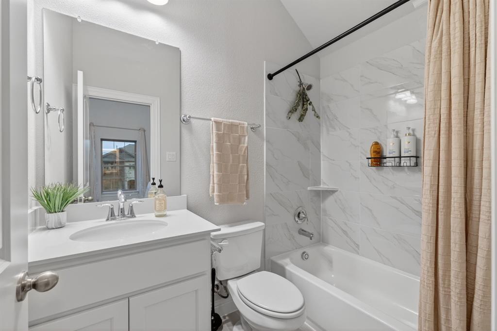4150 Gambel Road Prosper, TX 75078 - Photo 33 of 39 Full bathroom featuring shower / tub combo, vanity, and a textured wall