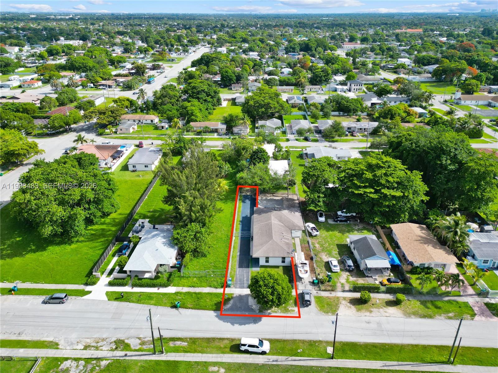 10357 Southwest 178th Street, Unit 10357 Miami, FL 33157 - Photo 2 of 25 an aerial view of residential houses with outdoor space and street view
