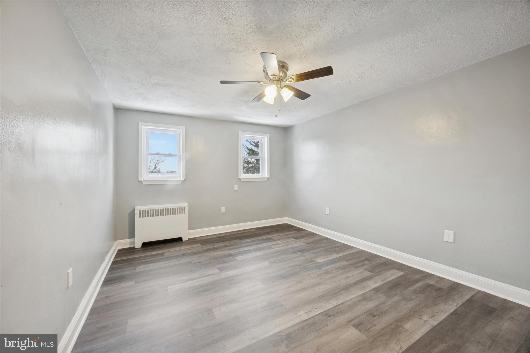 550 Wiltshire Road Upper Darby, PA 19082 - Photo 13 of 14 an empty room with a window and a ceiling fan