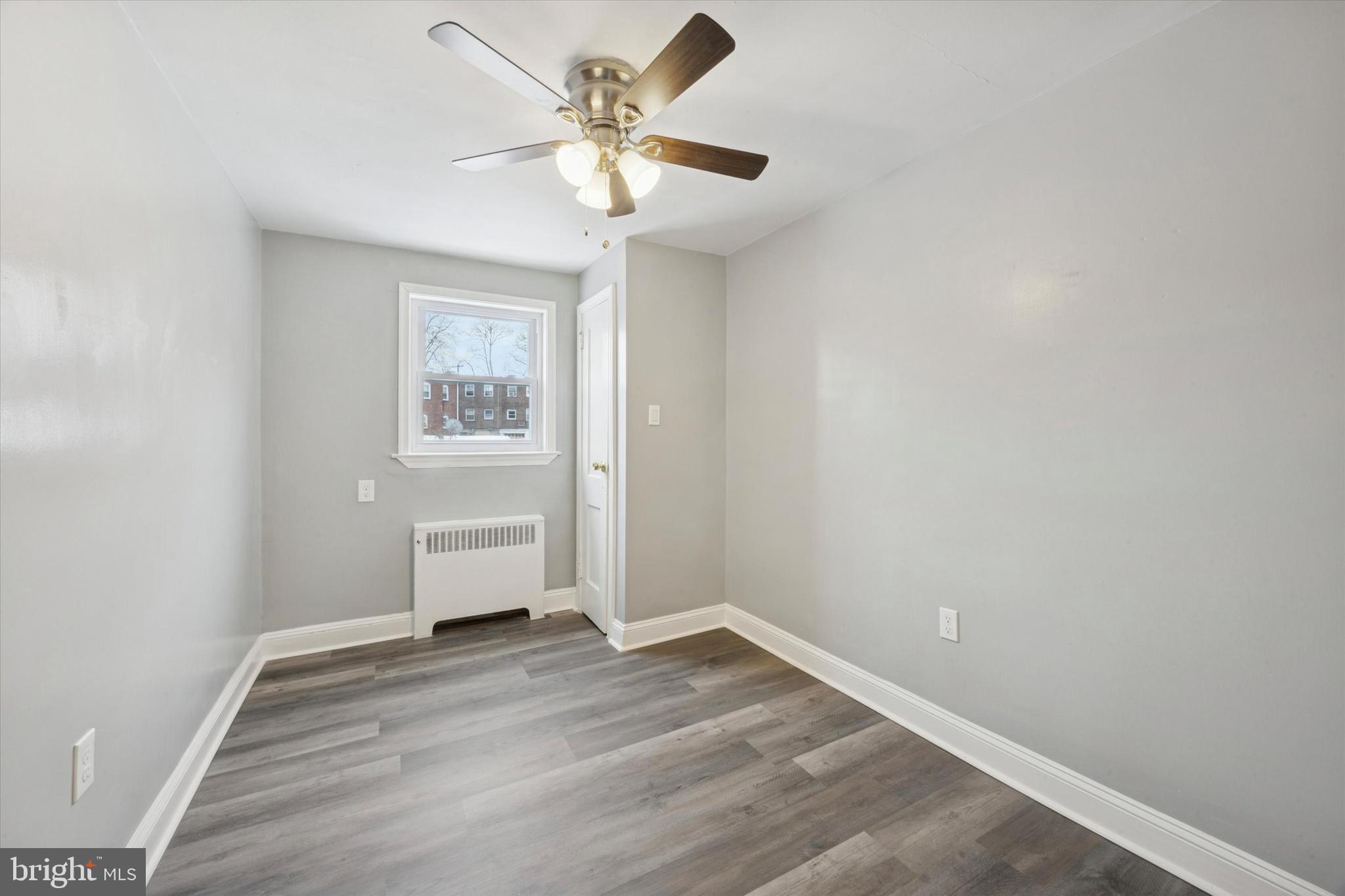 550 Wiltshire Road Upper Darby, PA 19082 - Photo 5 of 14 an empty room with a window and a ceiling fan