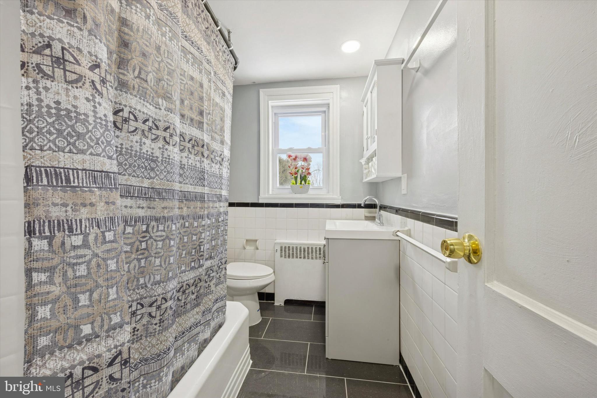550 Wiltshire Road Upper Darby, PA 19082 - Photo 10 of 14 a bathroom with a sink a toilet and a shower