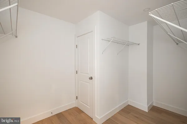 a bathroom with a sink a mirror and shower