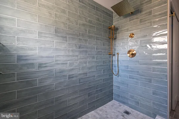 a bathroom with 2 sink and a mirror