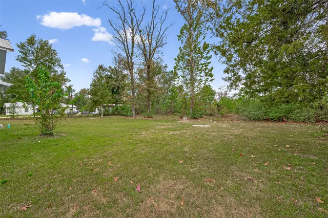 a view of outdoor space with deck and yard