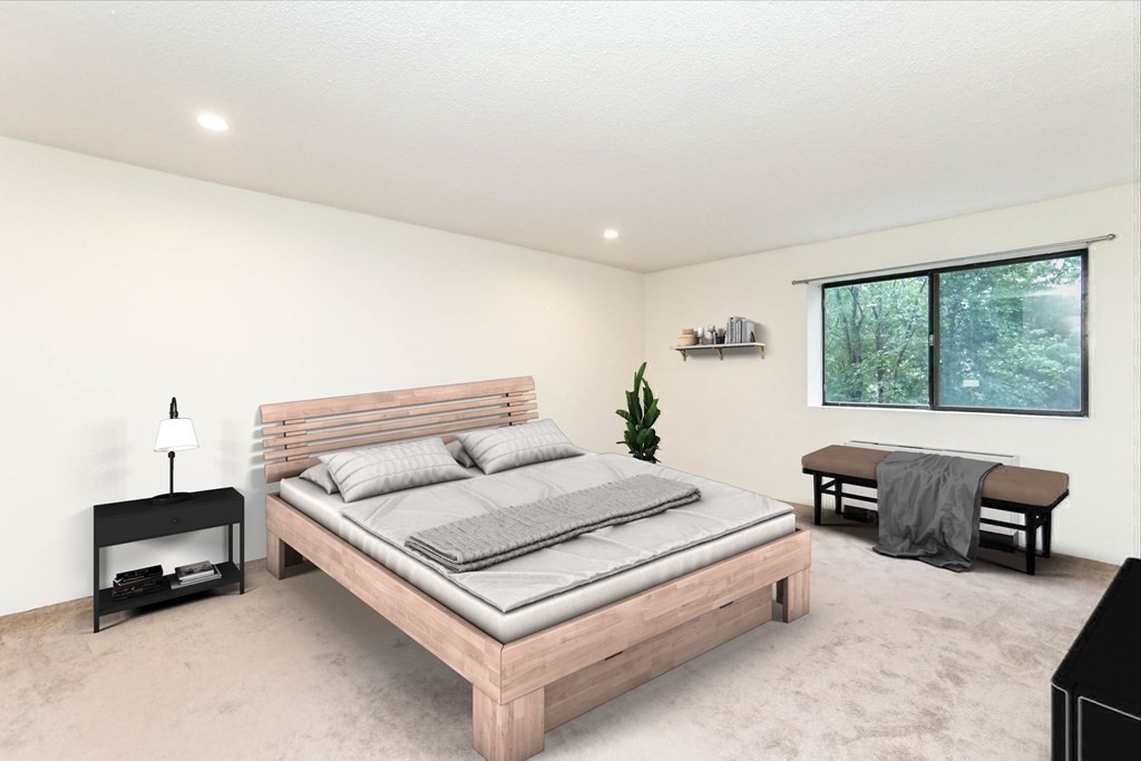 3 Summit Drive, Unit B2 Reading, MA 01867 - Photo 16 of 17 a living room with furniture and a window