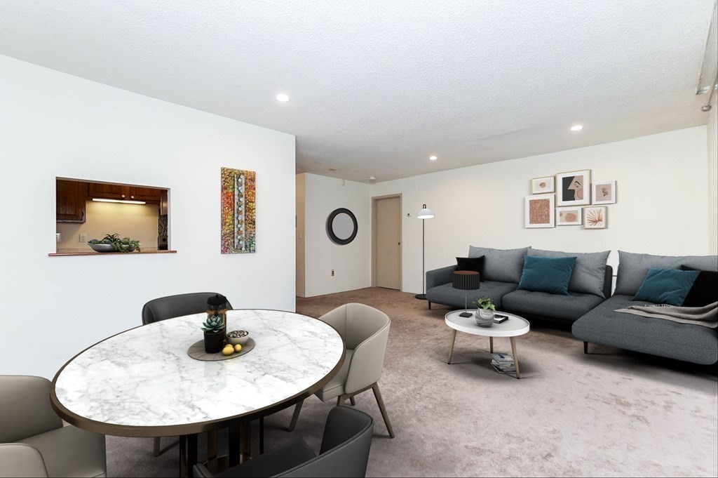 3 Summit Drive, Unit B2 Reading, MA 01867 - Photo 5 of 17 a living room with furniture and a mirror