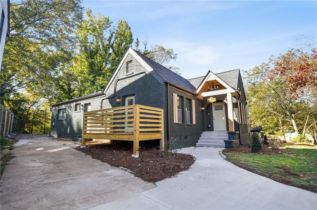 1580 Beecher Street Southwest Atlanta, GA 30310 - Photo 2 of 15 a front view of a house with a yard