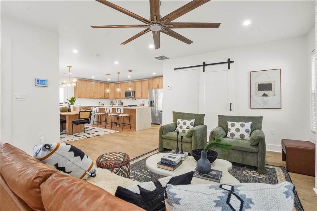 1580 Beecher Street Southwest Atlanta, GA 30310 - Photo 4 of 15 a living room with furniture and wooden floor