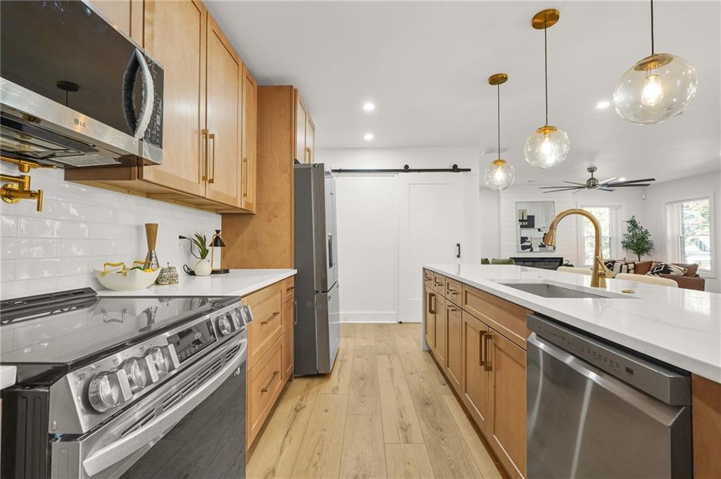 1580 Beecher Street Southwest Atlanta, GA 30310 - Photo 6 of 15 a kitchen with a sink and stove