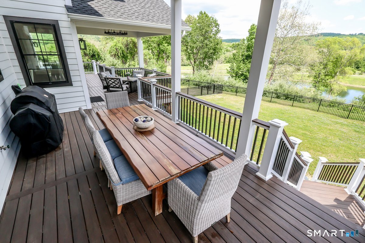 2 Pond View Lane Sherman, CT 06784 - Photo 39 of 40 a view of a balcony with chairs and wooden floor