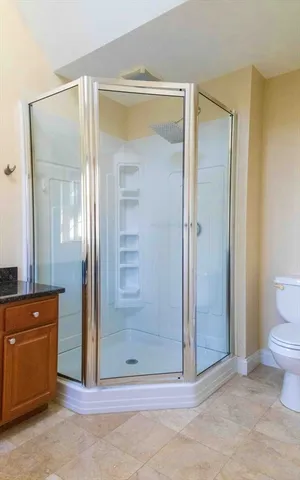 a bathroom with a shower and a sink