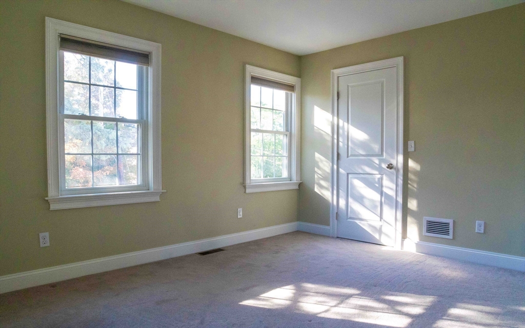 171 North Main Street, Unit 171 Natick, MA 01760 - Photo 15 of 19 an empty room with windows and closet