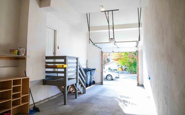 a room with furniture and a potted plant