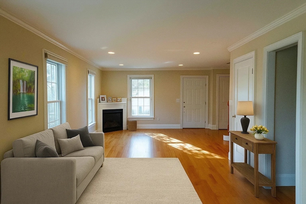 171 North Main Street, Unit 171 Natick, MA 01760 - Photo 5 of 19 a living room with furniture and a fireplace