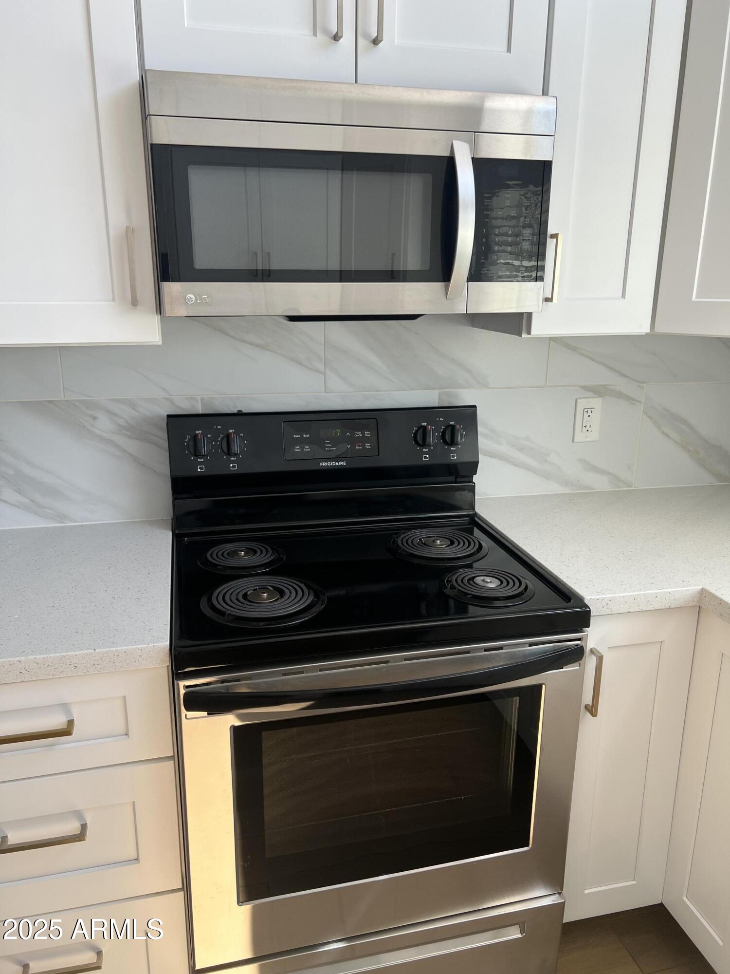 444 South Delaware Street Chandler, AZ 85225 - Photo 4 of 19 a stove top oven sitting inside of a kitchen