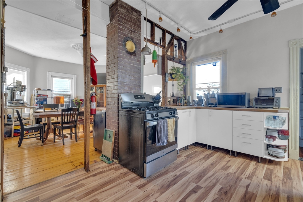 5 Sachem Street, Unit 3 Boston, MA 02120 - Photo 1 of 22 a kitchen with stainless steel appliances granite countertop a stove and cabinets