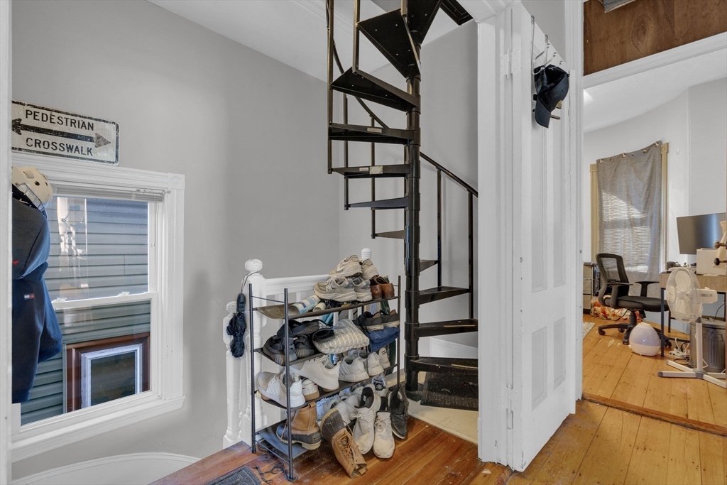 5 Sachem Street, Unit 3 Boston, MA 02120 - Photo 16 of 22 a view of a livingroom with wooden floor and furniture