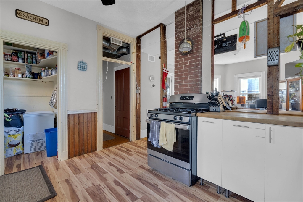 5 Sachem Street, Unit 3 Boston, MA 02120 - Photo 2 of 22 a kitchen with stainless steel appliances granite countertop a stove and a refrigerator