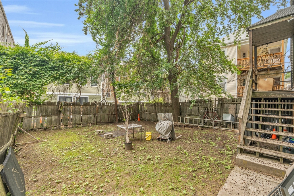5 Sachem Street, Unit 3 Boston, MA 02120 - Photo 22 of 22 a backyard of a house with table and chairs