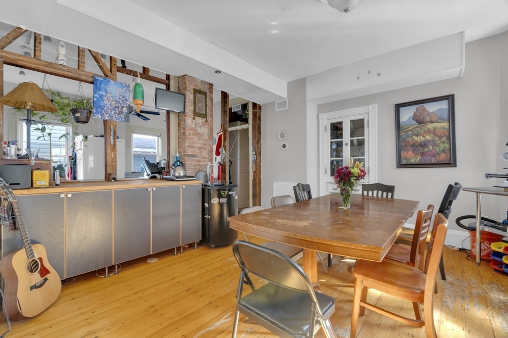 5 Sachem Street, Unit 3 Boston, MA 02120 - Photo 4 of 22 a view of a dining room with furniture and wooden floor