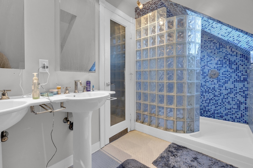 5 Sachem Street, Unit 3 Boston, MA 02120 - Photo 5 of 22 a bathroom with a sink and a mirror