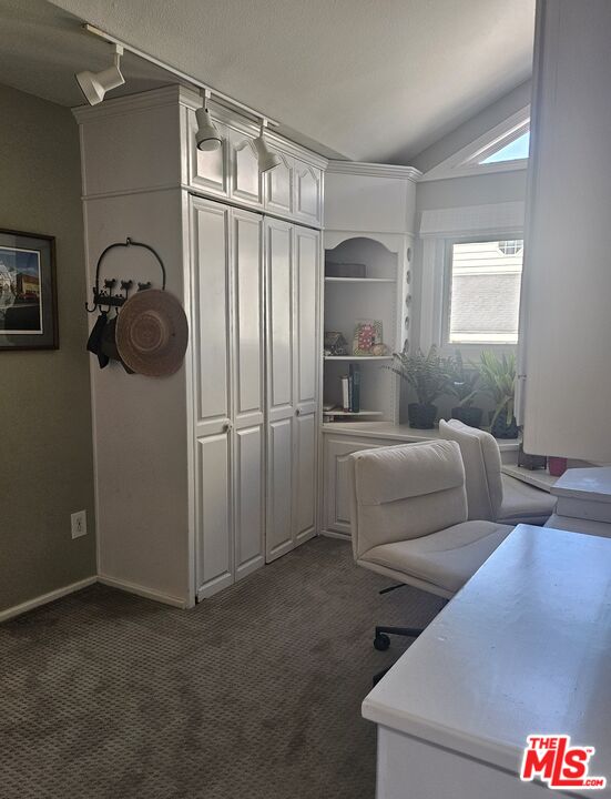 73 A Surfside Avenue Surfside, CA 90743 - Photo 13 of 18 a living room with furniture and a window