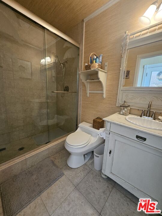 73 A Surfside Avenue Surfside, CA 90743 - Photo 14 of 18 a bathroom with a toilet sink and shower