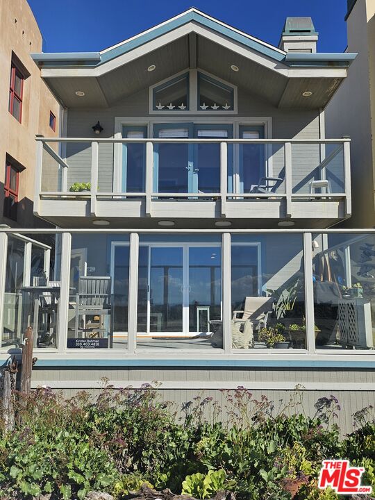 73 A Surfside Avenue Surfside, CA 90743 - Photo 2 of 18 a view of a house with a window and outdoor space