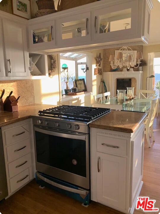 73 A Surfside Avenue Surfside, CA 90743 - Photo 4 of 18 a stove top oven sitting inside of a kitchen