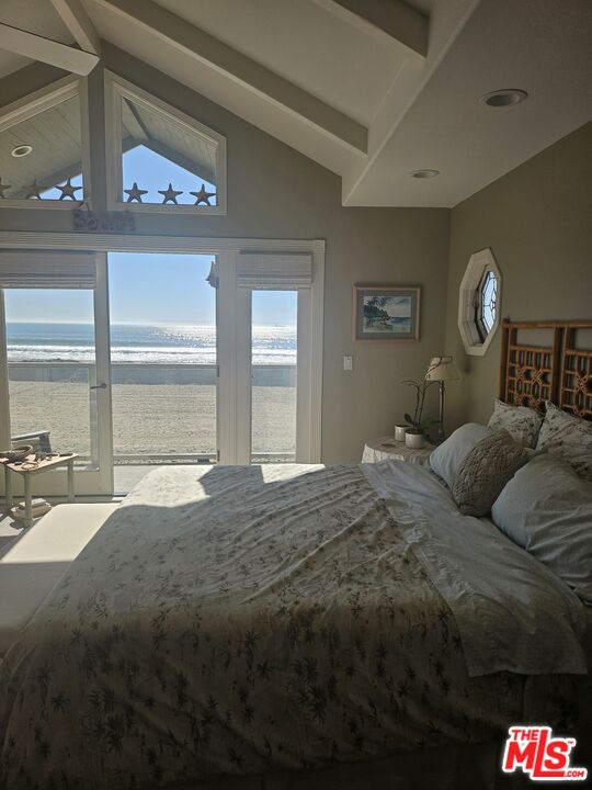 73 A Surfside Avenue Surfside, CA 90743 - Photo 7 of 18 a bedroom with a bed and a large window