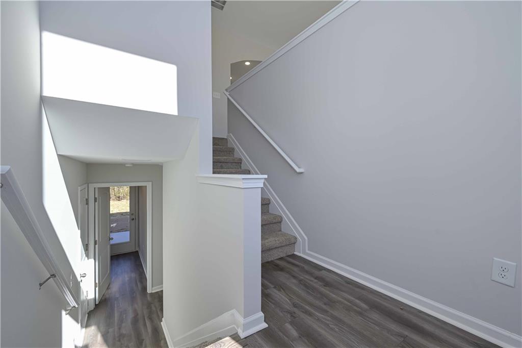 499 Charleston Place Villa Rica, GA 30180 - Photo 14 of 30 a view of a hallway with wooden floor and entryway