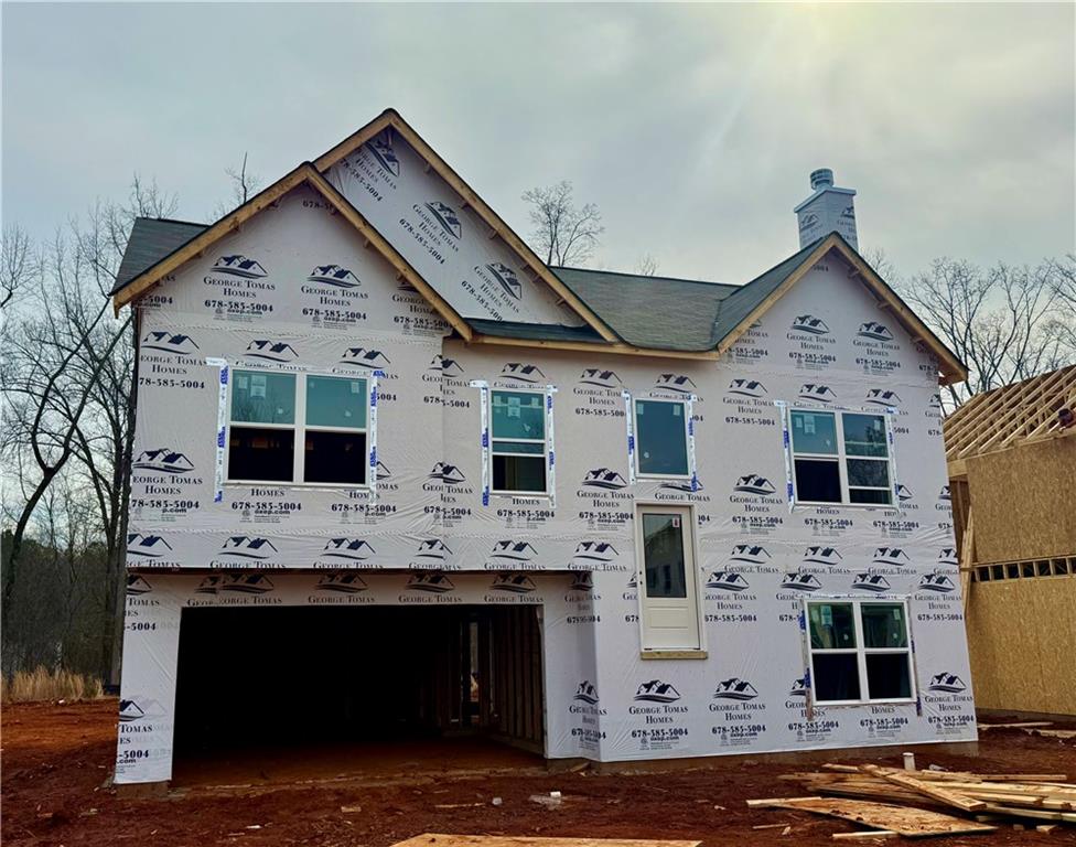 499 Charleston Place Villa Rica, GA 30180 - Photo 2 of 30 a view of open kitchen with granite countertop a stove top oven