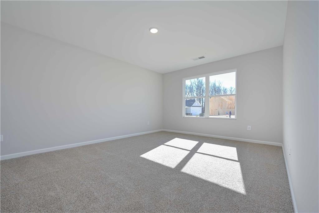 499 Charleston Place Villa Rica, GA 30180 - Photo 27 of 30 an empty room with windows