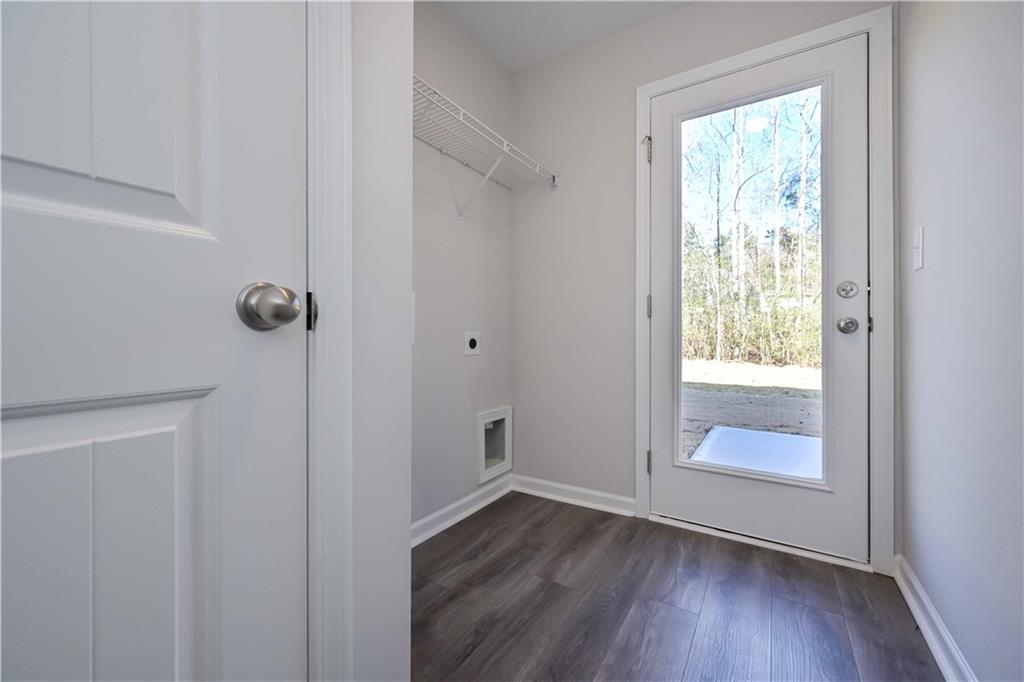 499 Charleston Place Villa Rica, GA 30180 - Photo 30 of 30 a view of an empty room with wooden floor and a window