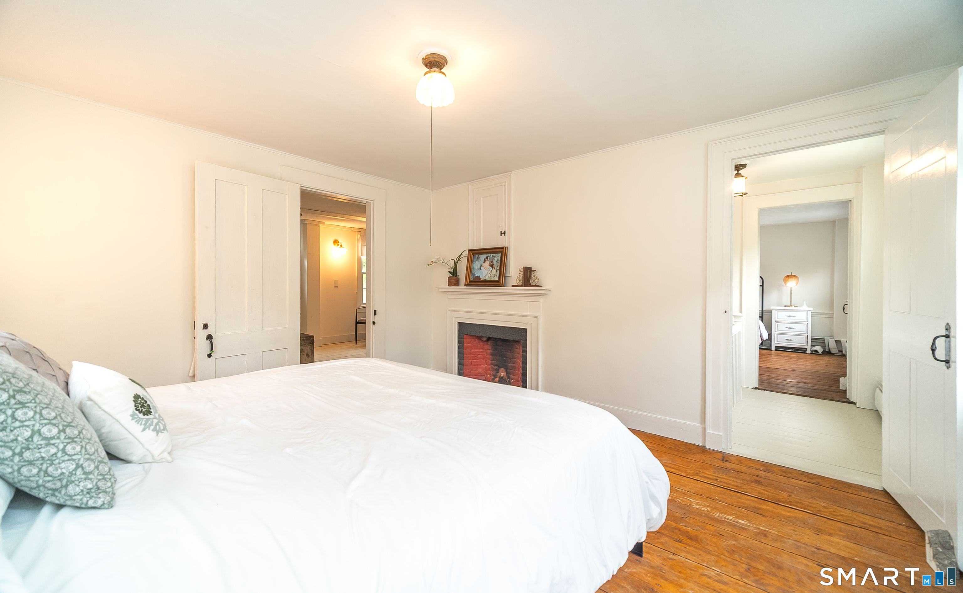 230 Killingworth Road Haddam, CT 06441 - Photo 21 of 36 a spacious bedroom with a bed and a dresser