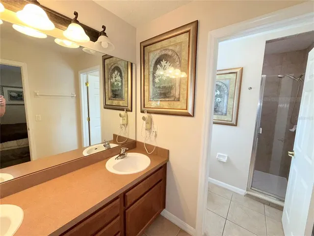 a bathroom with a sink vanity and a mirror