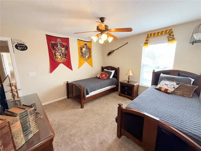 a bedroom with furniture and a window