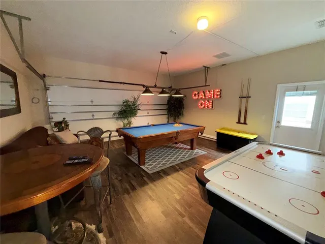 a bedroom with furniture and a chandelier